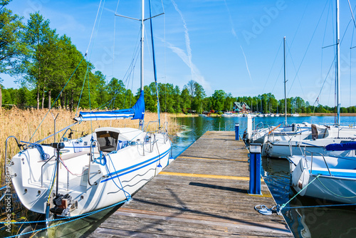 Obraz na płótnie View of small port marina with sailing boats on shore of Wigry lake, Wigry National Park, Podlasie, Poland w salonie
