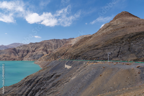 Amazing view of the Manla reservoir (Manak Dam Lake) and its translucent green water in Gyangze County of Shigatse, Tibet Autonomous Region of China