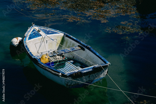 old fishing boat in a small port of brittany 
