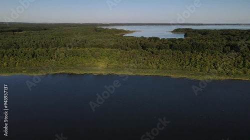 Fly over the a green and scenic nature area called Jabelscher See which is located at the Mecklenburg Vorpommern Lake area as the known former East Germany region photo