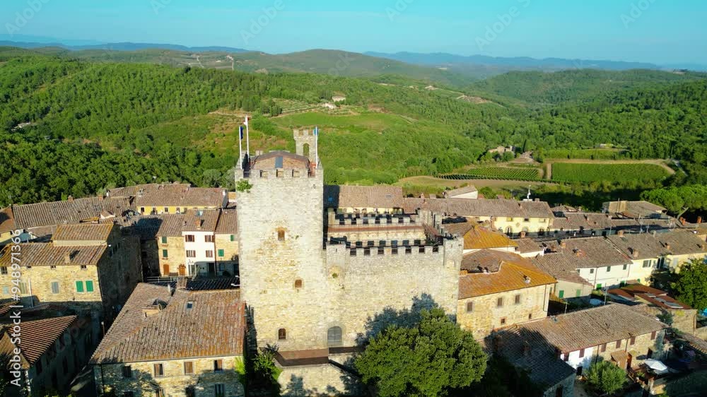 An aerial view of Castellina in Chianti, a picturesque town in Tuscany's renowned Chianti wine region, captured by a drone. Perched on a hill, Castellina in Chianti is surrounded by rolling vineyards An aerial view of Castellina in Chianti, a picturesque town in Tuscany's renowned Chianti wine region, captured by a drone. Perched on a hill, Castellina in Chianti is surrounded by rolling vineyards
