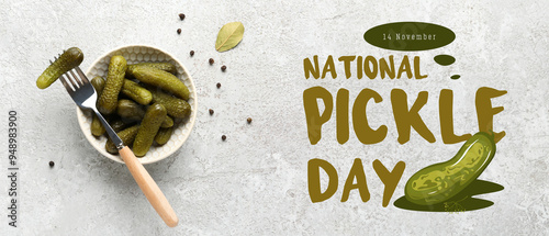 Bowl with tasty pickled cucumbers and peppercorn on grey background photo