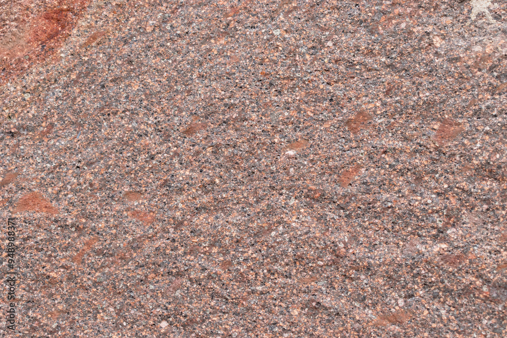 Rough texture of natural stone in shades of orange and brown Rough texture of natural stone in shades of orange and brown