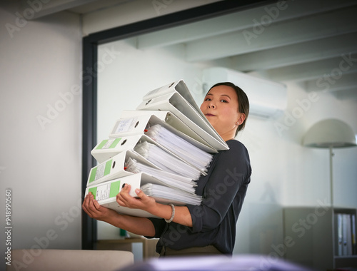 Portrait, carry and businesswoman with heavy paperwork in administration career crisis or workload. Folder, binder and overwhelmed administrator with stack or pile of documents for deadline workplace photo