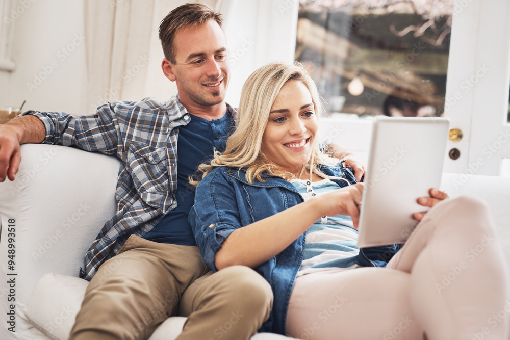 Love, relax and tablet with couple on sofa in living room of home for accommodation search together. Internet, online booking and smile of happy man and woman in apartment for travel confirmation
