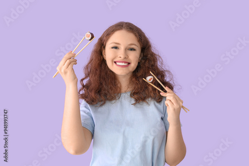 Young woman with sushi roll...