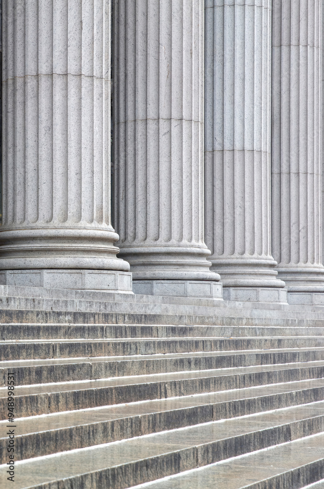 Stone colonnade and stairs detail. Classical pillars row in a building facade Stone colonnade and stairs detail. Classical pillars row in a building facade