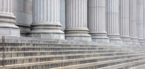 Stone colonnade and stairs detail. Classical pillars row in a building facade
