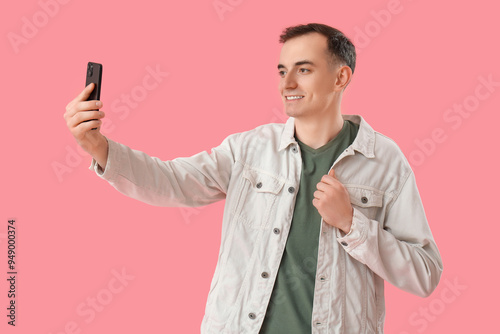 Young man with mobile phone...