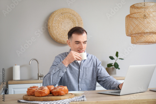 Young man with cup of coffe...