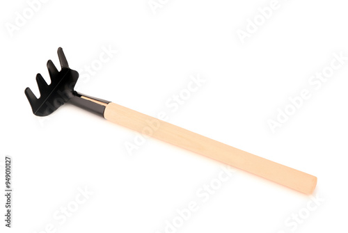 Gardening rake on white background