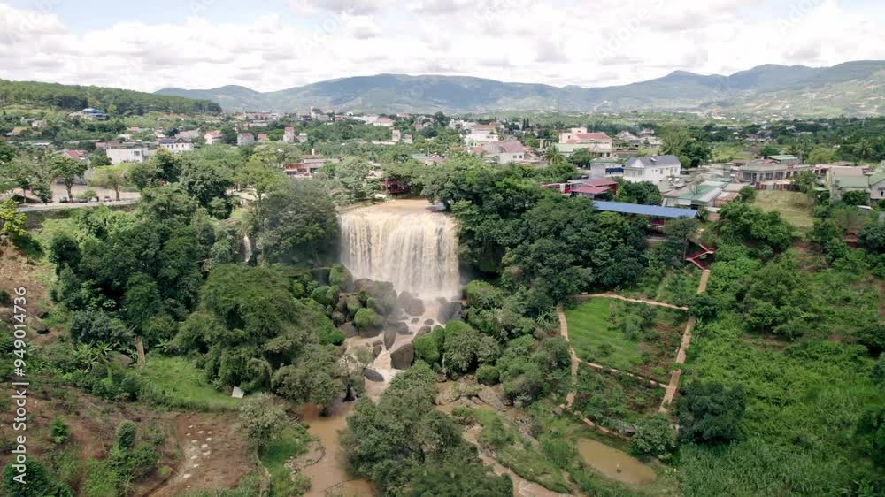Aerial view of elefant waterfall and cam ly river surrounded by lush greenery and mountains, Da Lat, Vietnam.