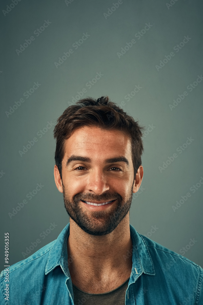 Happy, smile and portrait of man in studio with positive attitude, confidence and pride. Handsome, attractive and isolated person with joy, cheerful and excited expression on gray background Happy, smile and portrait of man in studio with positive attitude, confidence and pride. Handsome, attractive and isolated person with joy, cheerful and excited expression on gray background