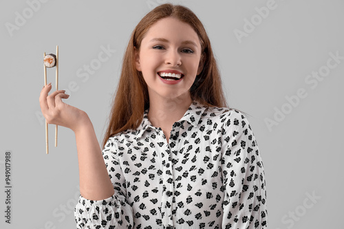 Young woman with tasty sush...