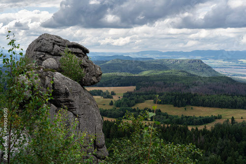 Rock Monkey Head (apeman) known as well as teddy bear (rock formation). Play of lights during the day in Stolowe Mountains National Park near Kudowa-Zdroj resort, Lower Silesia, Sudety, Poland.  photo