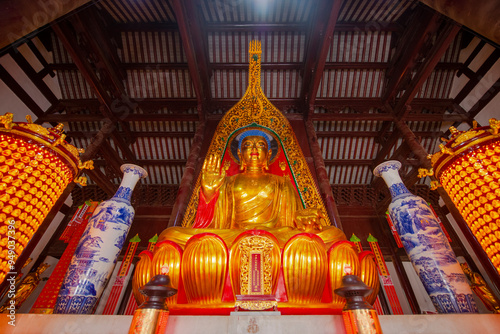 Sakyamuni (Siddhartha Gautama) shrined in Mahavira Hall of Longchang Temple. Longchang Temple is a Vinaya Buddhist temple on Mount Baohua, Town of Jurong, Zhenjiang City, Jiangsu Province, China.  photo