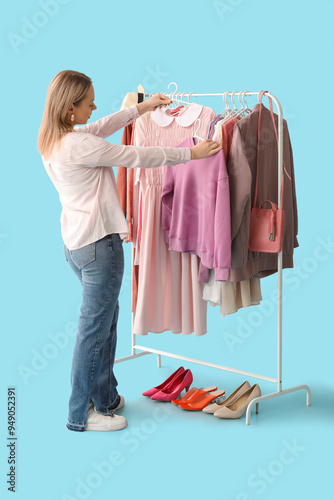Female stylist with clothes...