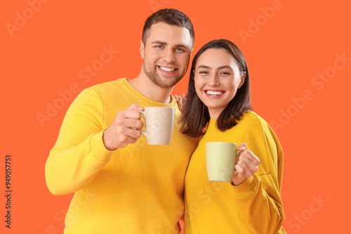 Young couple with cups of t...