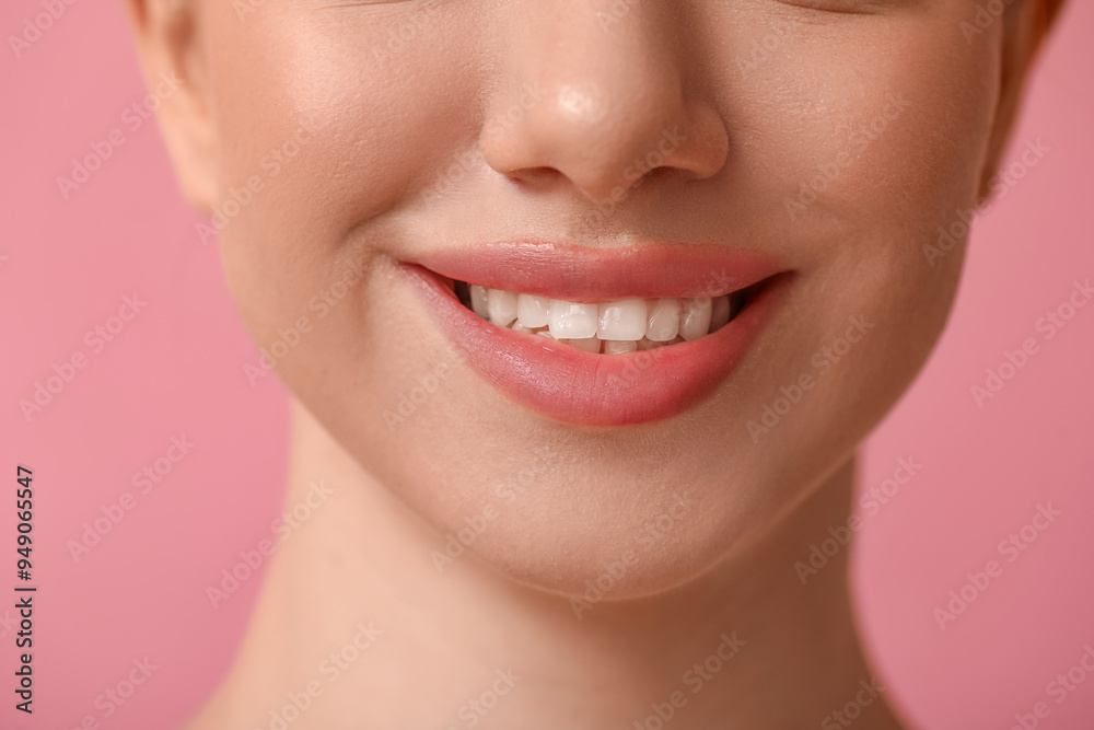 Fototapeta premium Smiling young woman with beautiful lips on pink background, closeup
