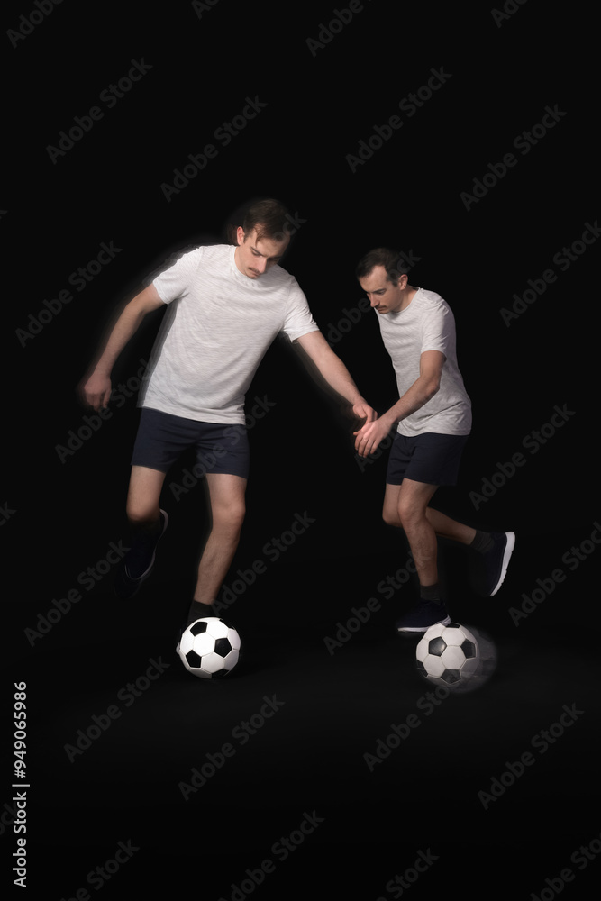 Young man playing with soccer ball in motion on black background Young man playing with soccer ball in motion on black background