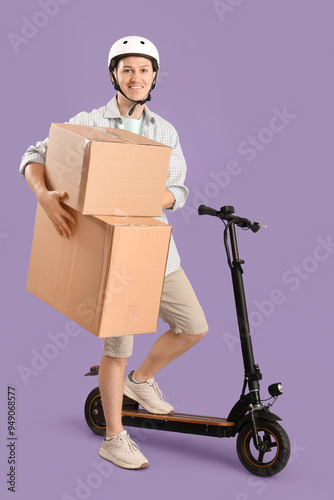 Male courier with big cardb...