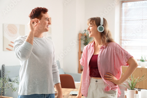 Young man with hearing aid ...