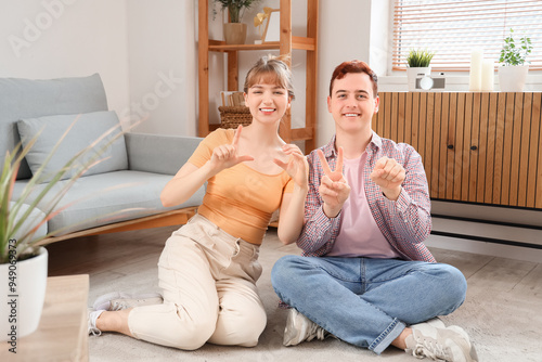 Young deaf mute couple usin...