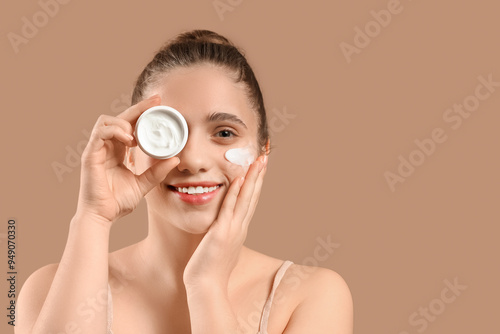 Young woman with jar of fac...