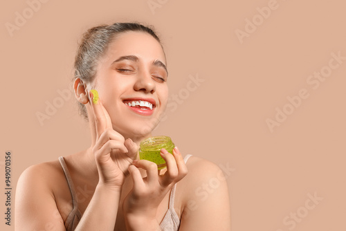 Young woman with jar of scr...