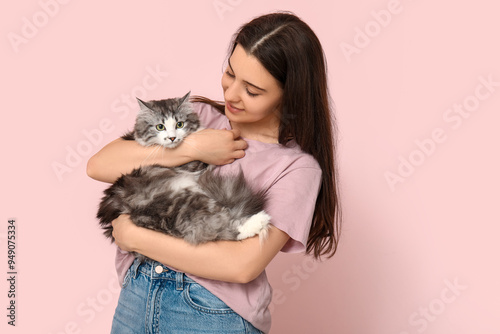 Young woman holding cute lo...