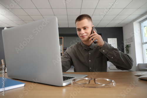 Young male businessman with...