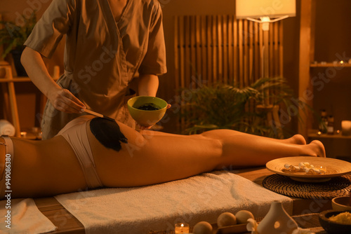Massage therapist applying ...