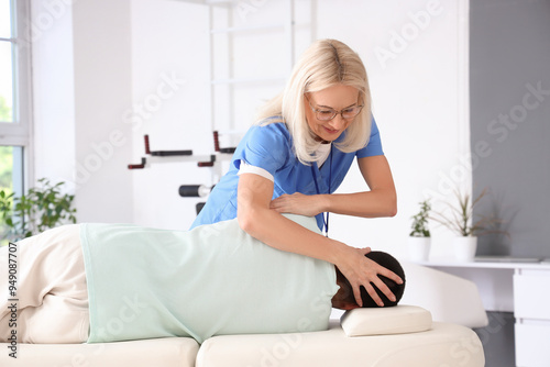 Female physical therapist a...