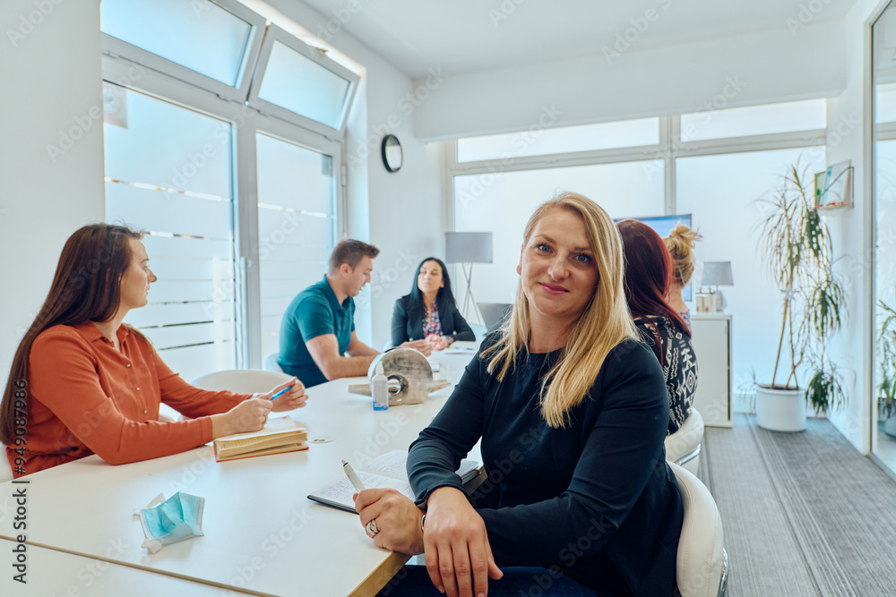 Diverse Business Team Discussing Projects in a Modern Glass Office. Diverse Business Team Discussing Projects in a Modern Glass Office.