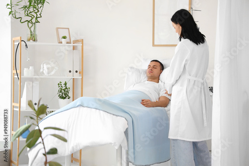 Female doctor giving drip i...