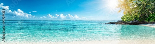 A serene tropical beach with crystal clear water, golden sand, and palm trees under a bright blue sky.