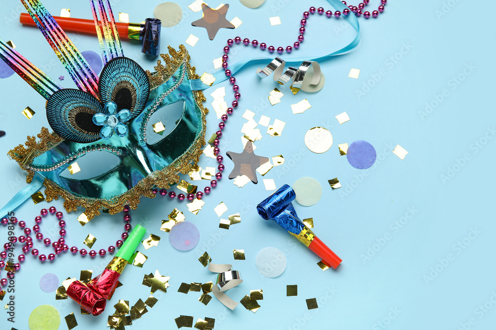 Fotografie Carnival mask with decor on blue background