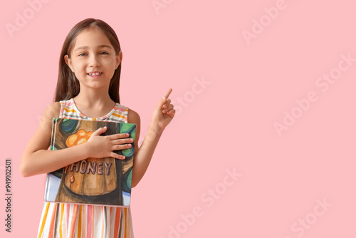 Cute little girl with book ...