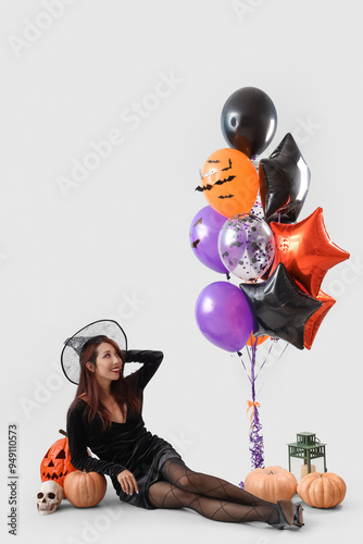 Young asian woman in witch ...