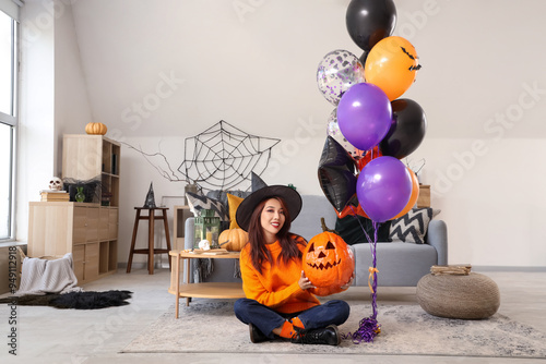 Young Asian woman in witch ...