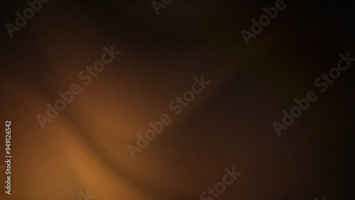 Fototapeta Naklejka Na Ścianę i Meble -  Warm and rich 4K abstract background with deep brown and gold gradients. Perfect for adding a sophisticated, grainy, and luxurious touch to any design