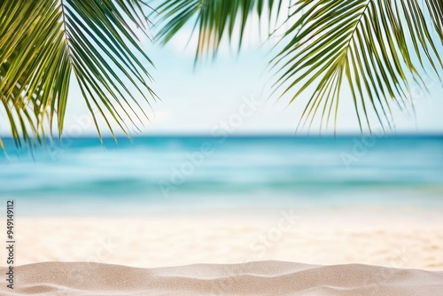 Beautiful summer background with palm leaves, sandy beach, and blurred sea view, ideal for vacation themes. Captured with a Nikon D850.