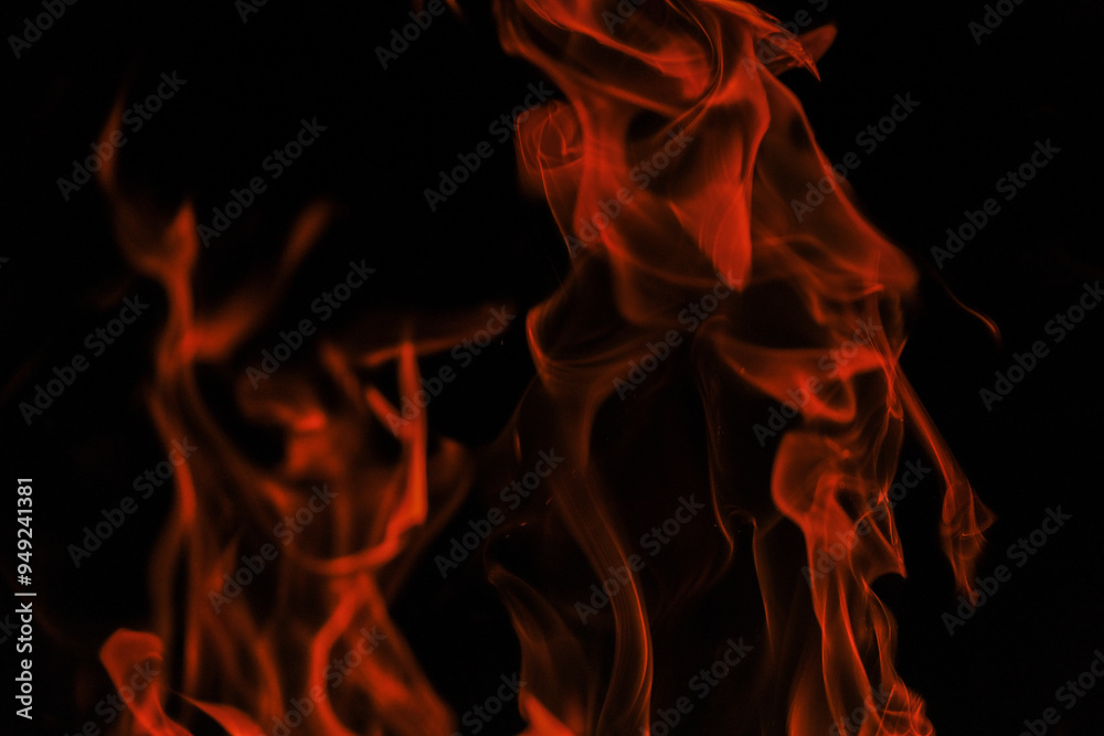 Fire texture on black background. Flames on a black background. Tongues of flame, sparks close-up. Fire texture on black background. Flames on a black background. Tongues of flame, sparks close-up.