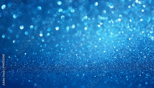 Close-up of shimmering blue glitter particles softly catching the light, with a gentle bokeh