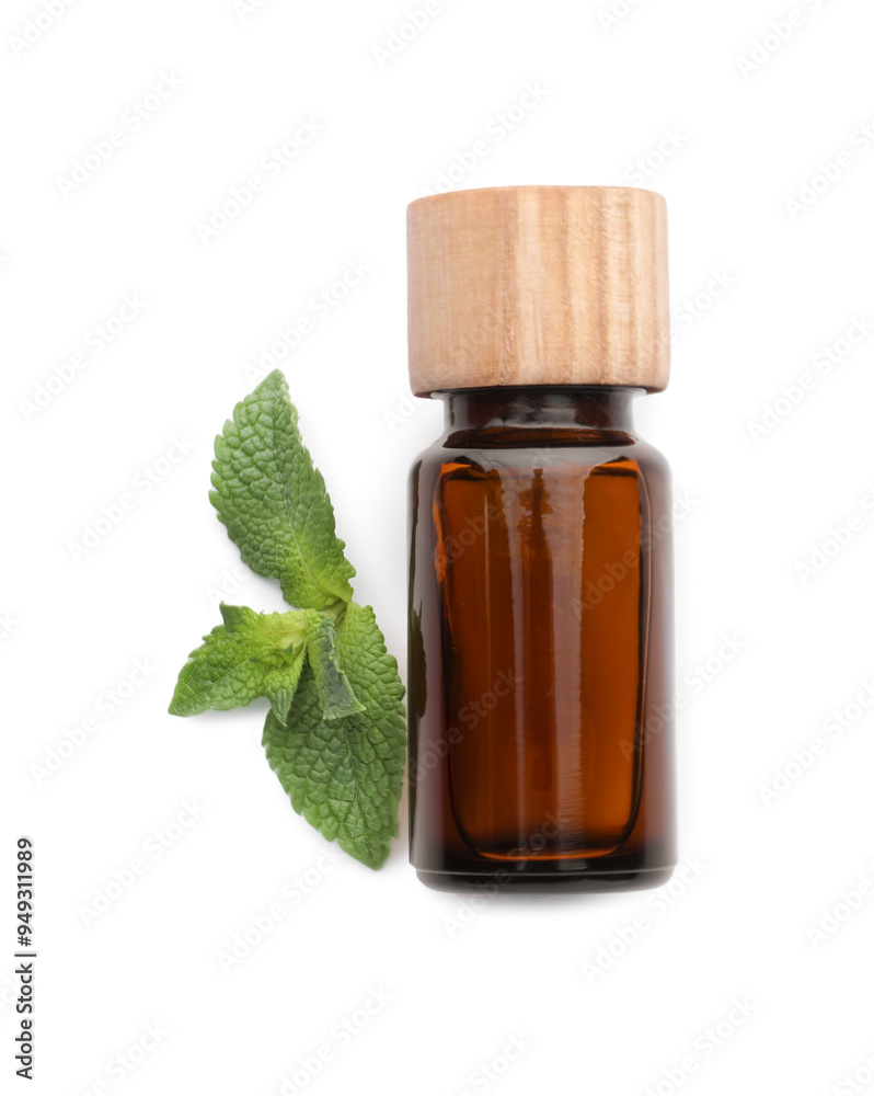 Bottle of essential oil and mint isolated on white, top view Bottle of essential oil and mint isolated on white, top view