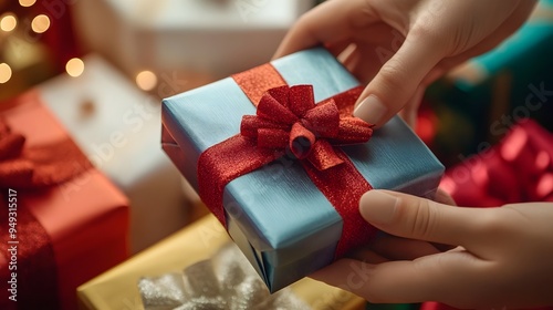 Placing a Wrapped Gift Box on a Pile of Presents for a Festive