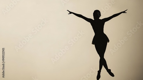 Silhouette of a ballet dancer gracefully performing a ballet pose against a neutral background, capturing elegance and poise.