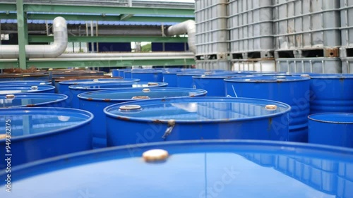 Neatly Arranged Oil and Chemical Storage Tanks in Yard Awaiting Disposal at Hazardous Waste Plant, Industrial and Environmental Management, Safe Waste Handling, Sustainable Industrial Practices, Eco-F