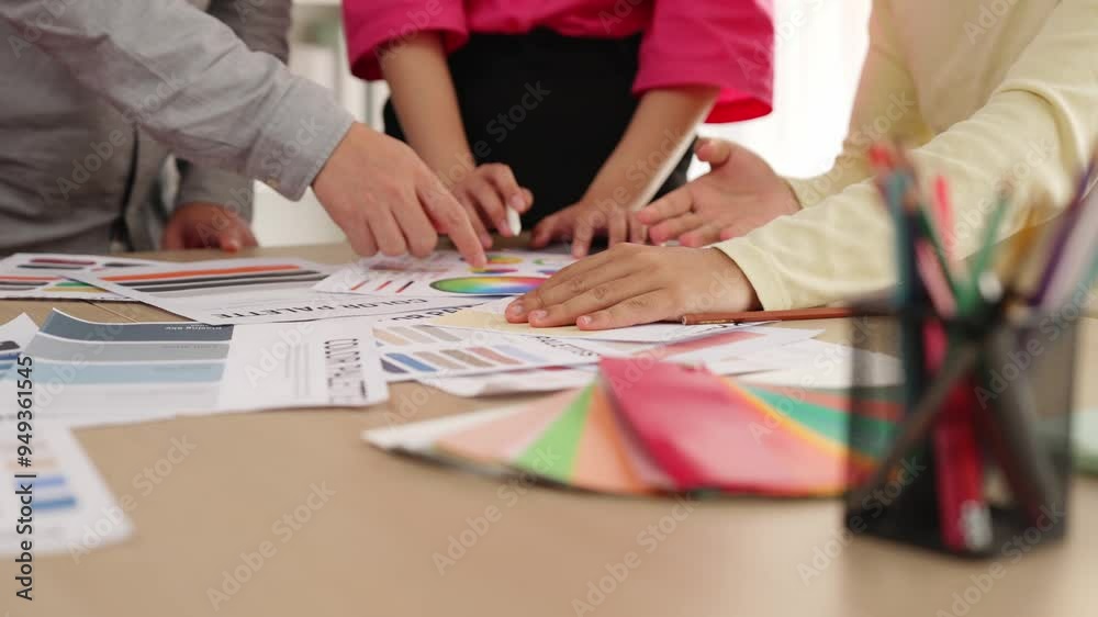 Slow motion hand closeup of designer team brainstorming and choosing color for graphic design working or client asking advise with chromatic consultation at designer agency office. Variegated