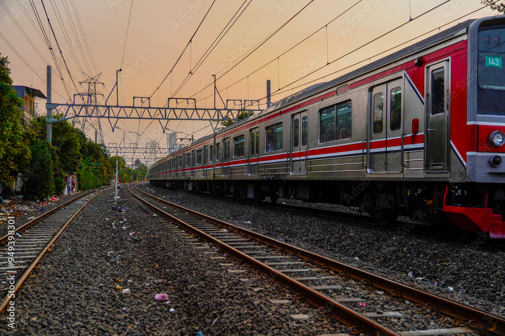 Modern electric passenger train entering the train station. Summer landscape in the background with photocopy blank rusng. Modern electric passenger train entering the train station. Summer landscape in the background with photocopy blank rusng.